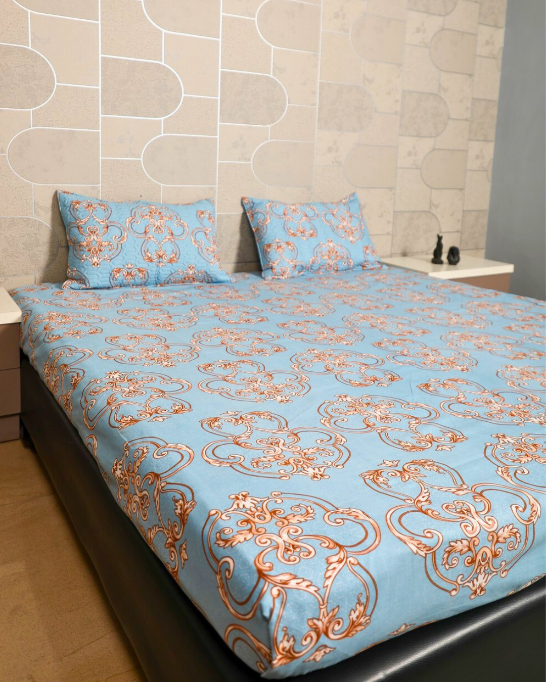 Blue king size bedsheet with intricate royal motifs and matching quilted pillow cover