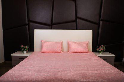 Anthurium- DOUBLE BED BEDSHEET WITH QUILTED PILLOW COVER ( Pink colour)
