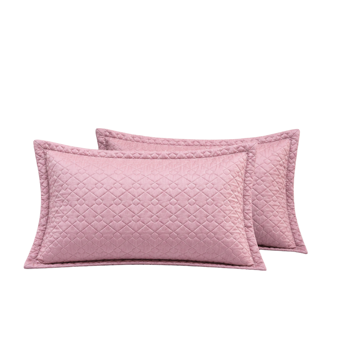 Two dusty pink quilted lumbar pillows with matching piped edges, arranged overlapping on a solid white background.