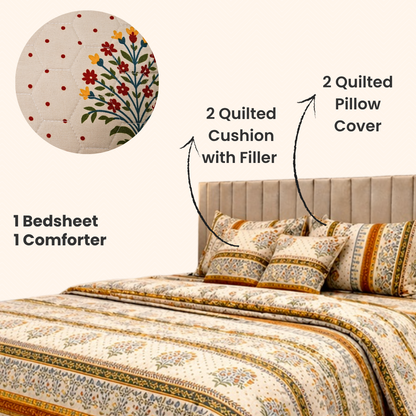 Bedding set with quilted pillow cover, quilted cushion with filler, and king size bedsheet along with comforter of same print on a bed.