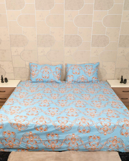 Blue king size bedsheet with intricate royal motifs and matching quilted pillow cover close up