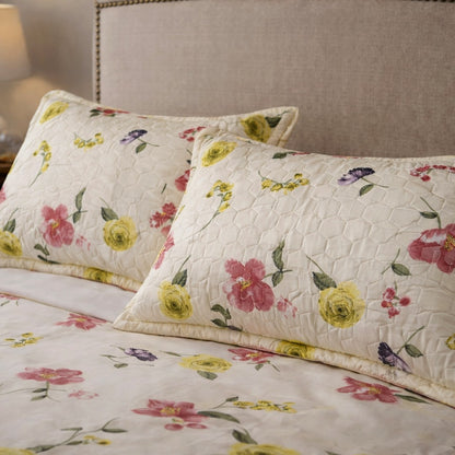 lime yellow cotton feel bedsheet fabric close up floral print soft breathable texture 180 GSM with quilted pillow cover detail