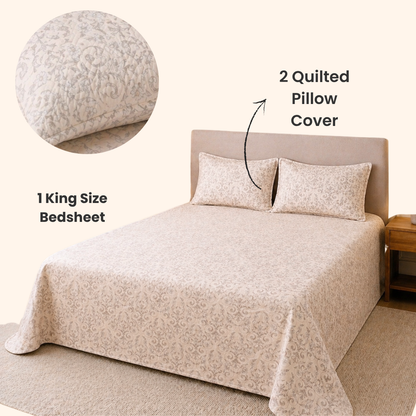 Bedding set with king size bedspread, two quilted pillow covers, and a close-up of a quilted pillow on a bed