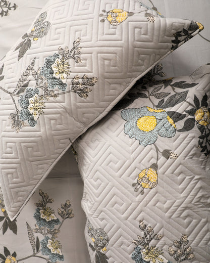 gray with floral print king size bedsheet with close up of quilted pillow cover