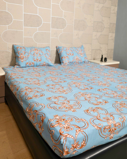 Blue king size bedsheet with intricate royal motifs and matching quilted pillow cover 